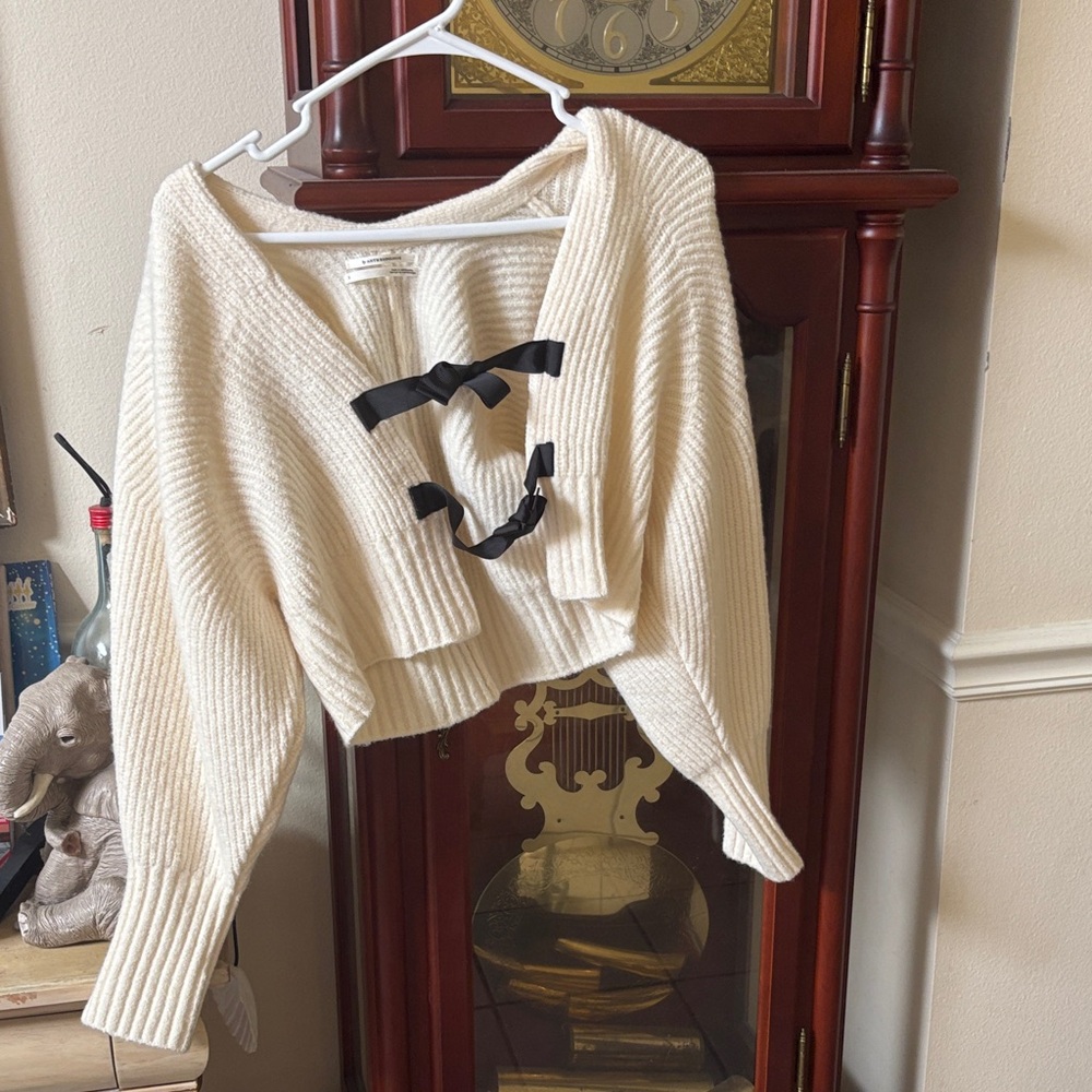 Anthropologie Ivory Cardigan with Black Bow Accents